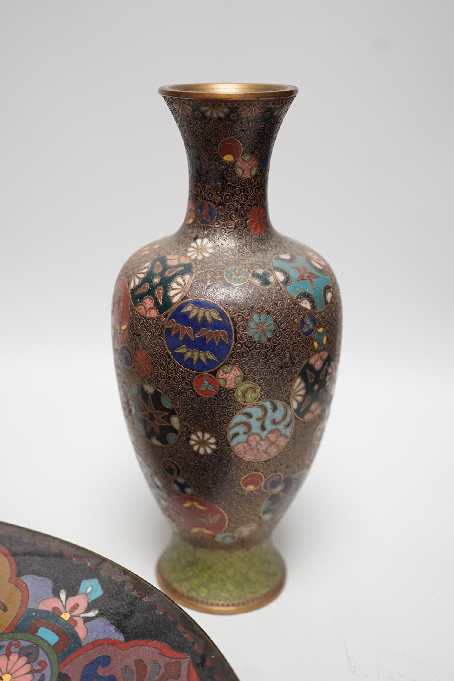 A Japanese cloisonné enamel dish, 30.5cm diameter and a pair of Japanese cloisonné enamel vases. (3)